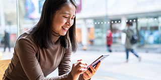 a woman looking at her mobile phone